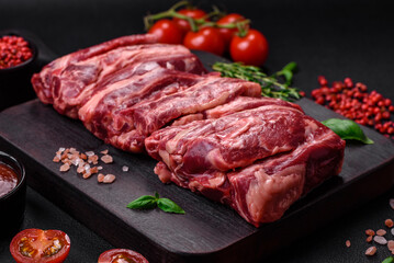 Fresh raw beef ribs with salt, spices and herbs