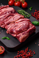 Fresh raw beef ribs with salt, spices and herbs