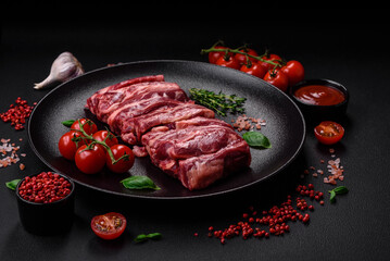 Fresh raw beef ribs with salt, spices and herbs