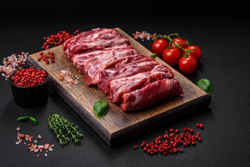 Fresh raw beef ribs with salt, spices and herbs