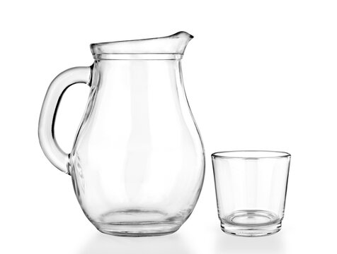 Empty jug and glass on a white background.
