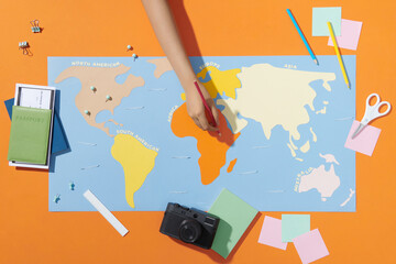 Tourism planning with hand writing note on world map