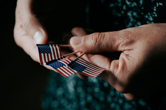 man with some small US flags