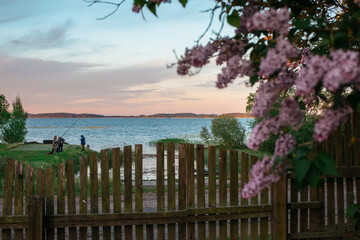 Fototapeta premium Lake with fishermen at dawn