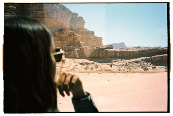 Woman looking at bus view in Wadi Rum desert
