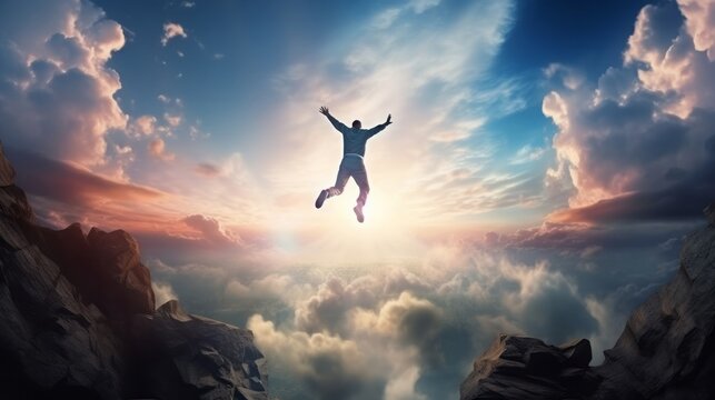 A man jumping into the air from a cliff