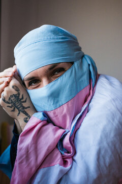 Sweet non binary person smiling 