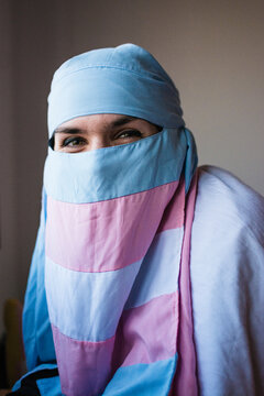 Happy non-binary person using trans niqab