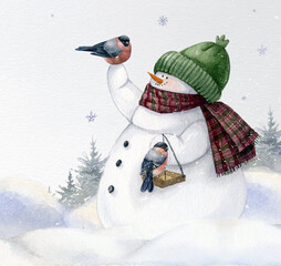 Watercolor hand-drawn funny snowmen hold bird feeder with birds. Winter Christmas holidays card. Cute snowman in a green hat and scarf on a snowy winter field landscape. Merry Christmas postcard