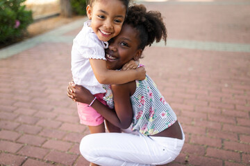 fun and games between black sisters outdoors
