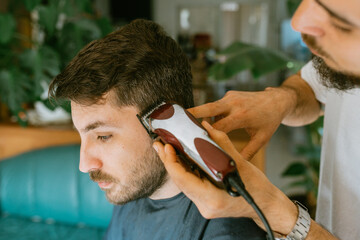 Barber expertly using an electric razor 