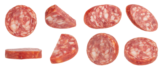 Dried sausage slices on a white isolated background. Sausage slices in different cuts are suitable for inserting into a design or project.