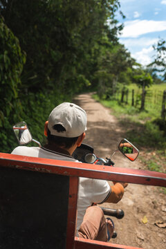 Man driving cargo motorcycle