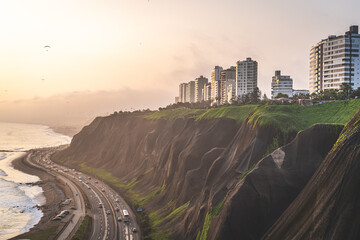 Winding road during the Sunset in la Costa Verde (Green Coast) in Lima, Peru - 620695893