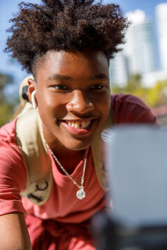 High School Student Using Mobile Phone Chatting Or Making A Video