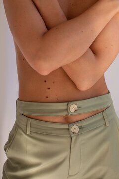 Crop model covering torso with hands
