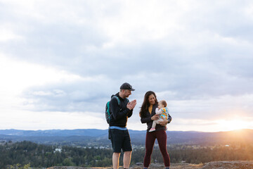 Family having fun and enjoying each other outside at sunset.