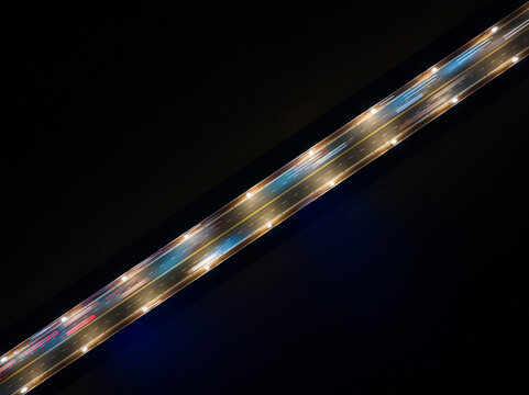 Top down aerial view of traffic on freeway interchange 
