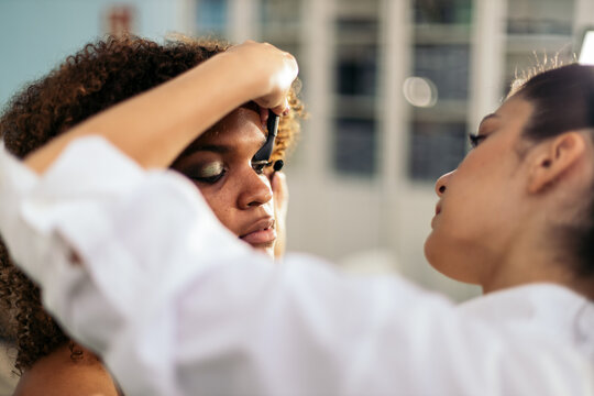 Woman Getting Her Makeup Done By A Makeup Artist