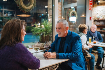 Mature couple having date in cafe