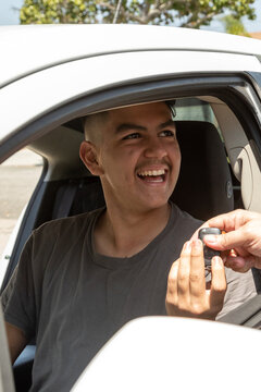 Father teaches teen son to drive