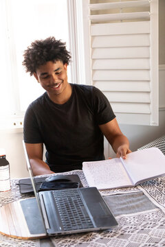 Teenager studies at home 