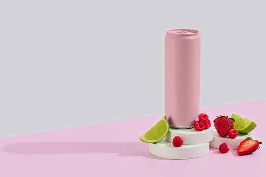 pink drink can on props with berries and lime.
