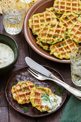 Zucchini wafers with dill and onion, served with sour cream sauce and wine.