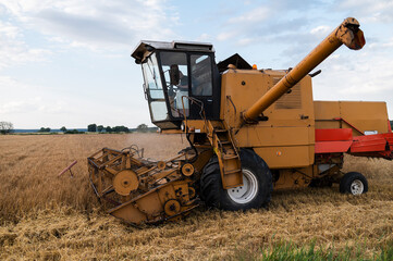 combine harvester mows grain during harvest