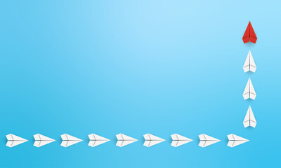 Growth and development concept with red paper plane flying up with white paper plane on blue background. Copy space.