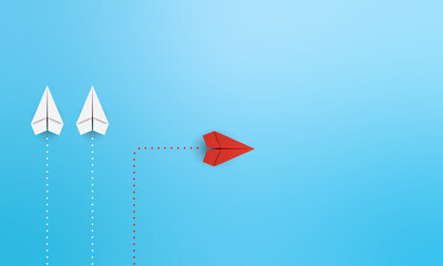 New normal concept with Red paper plane in new direction on blue background. Copy space
