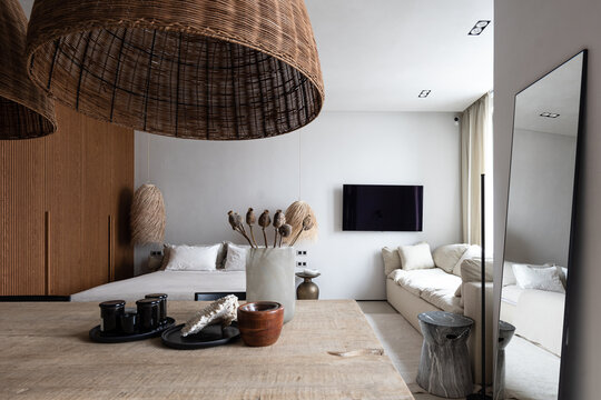 Big studio, natural materials, wood table mirror television wardrobe 