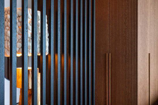 Wood panels separating the entrance hall and the bedroom