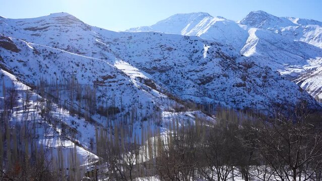 snow mountains in remote village in uzb
