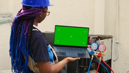 Meticulous wireman ordering new internal components on mock up laptop for malfunctioning HVAC...