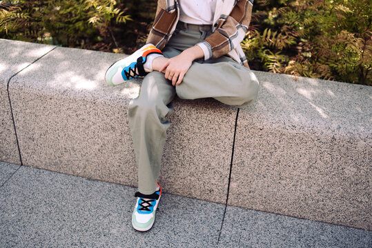 Teen sitting at the street