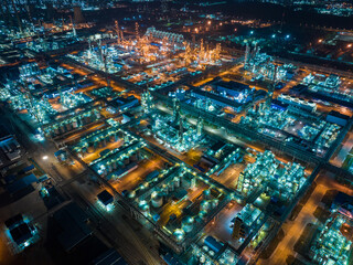 Aerial view oil and gas tank with oil refinery background 