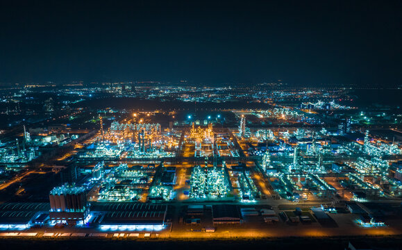 Aerial view oil and gas tank with oil refinery background 