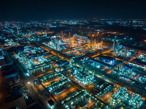 Aerial view oil and gas tank with oil refinery background 