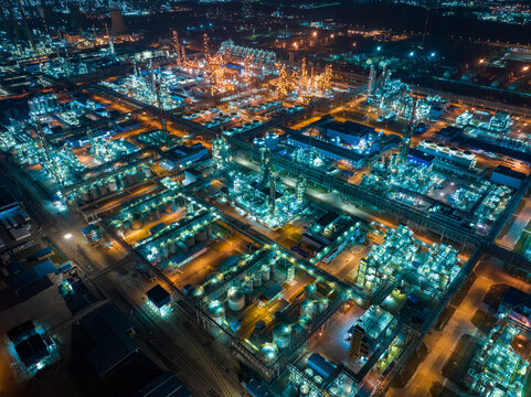 Aerial view oil and gas tank with oil refinery background 