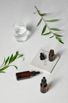 Composition with bottles of natural tea tree oil and space for text