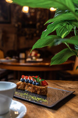 Sweet dessert in a restaurant. Wooden background