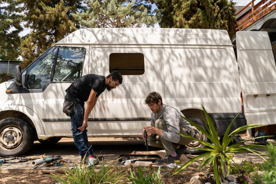 Friends making van conversion