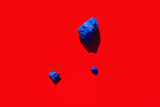 Colorful painted stones on a coloured background
