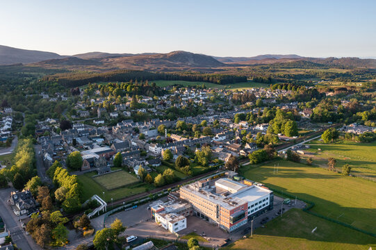 Aerial View of Kingussie Scotland with the Scottish Highlands in the Background at Sunset