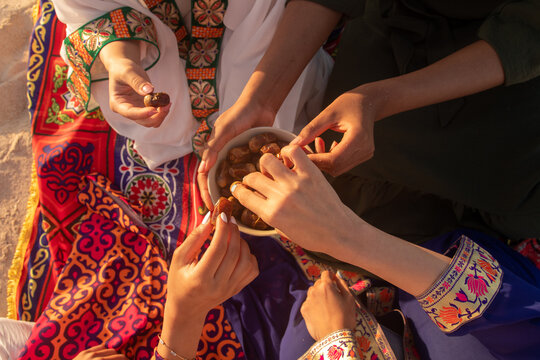 Friends Breaking Fast Together with Dates