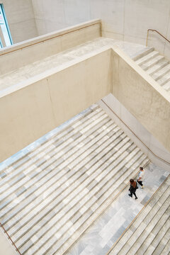 Overhead View of a Couple Walking up Concrete Stairs