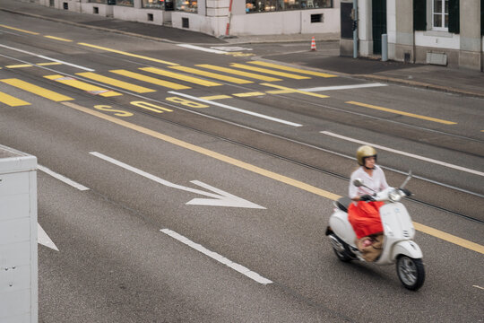 Woman Speeding through the City