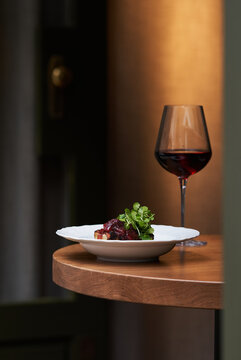 Elegant dish with glass of wine