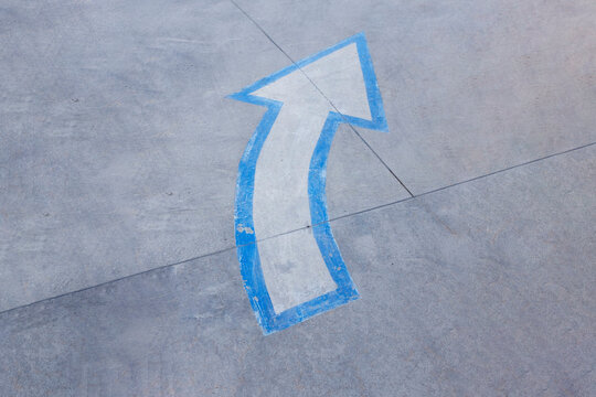 Arrow signpost on a street